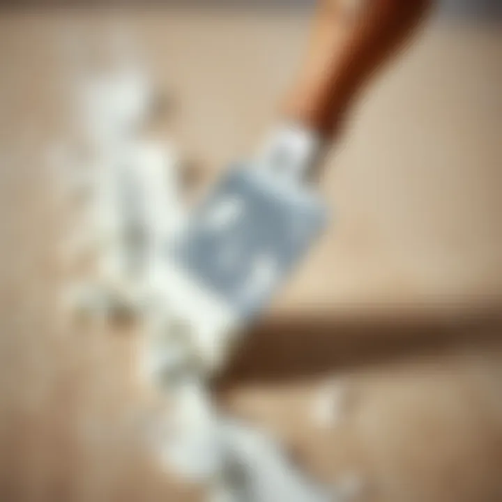 Precision Application of Joint Compound A close-up of a trowel applying joint compound