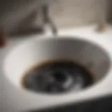 Accumulation of black gunk in a bathroom sink drain