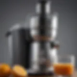 Close-up of the juicer's sleek design highlighting its stainless steel finish