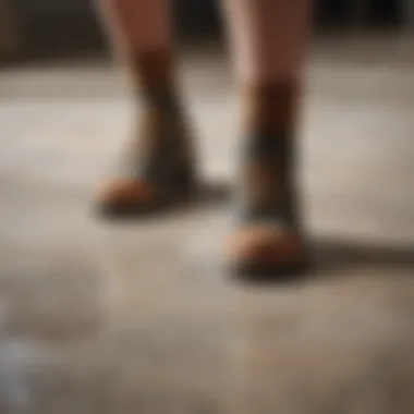 A close-up of a person applying cleaner to a stone floor