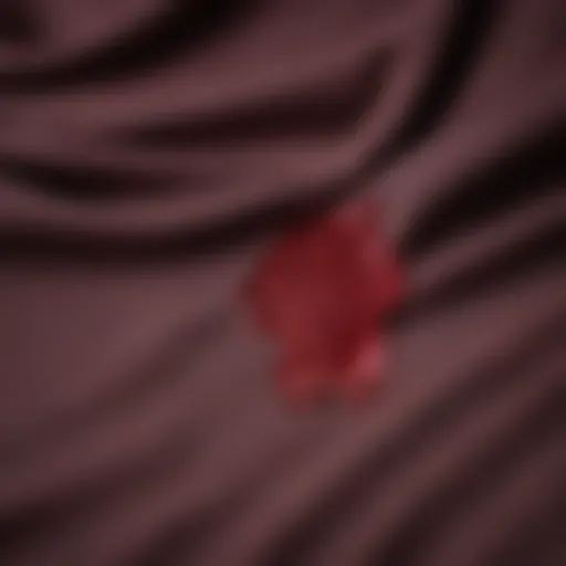 Close-up of a cotton fabric with a red wine stain