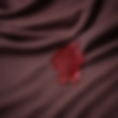 Red Wine Stain on Cotton Fabric Close-up of a cotton fabric with a red wine stain