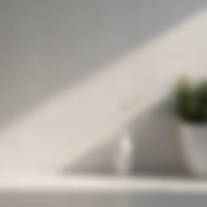 Various white paint finishes displayed on a wall