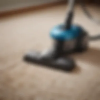 Close-up of a vacuum cleaner demonstrating strong suction power on carpet fibers.