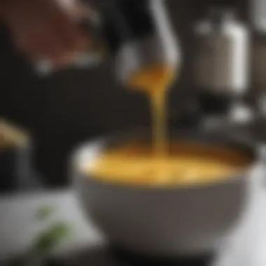 Blending Soup to Perfection with an Immersion Blender Close-up of an immersion blender in action blending a creamy soup