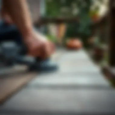 Close-up of deck surface being sanded