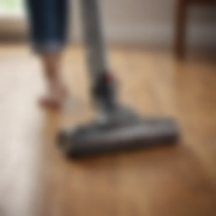 A pet owner using a vacuum cleaner on a wooden floor, demonstrating effective cleaning practices.