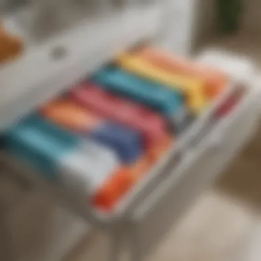 Organized towel drawer showcasing color-coded towels