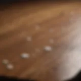 Close-up of white spots on a wood table surface