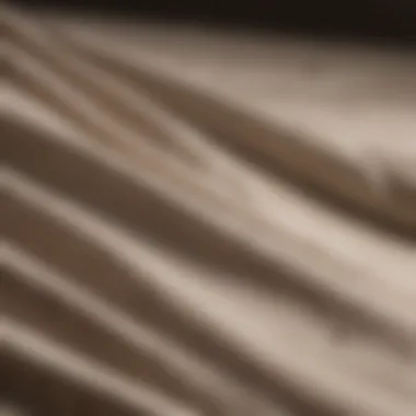 A close-up of fabric being treated with vinegar for stain removal